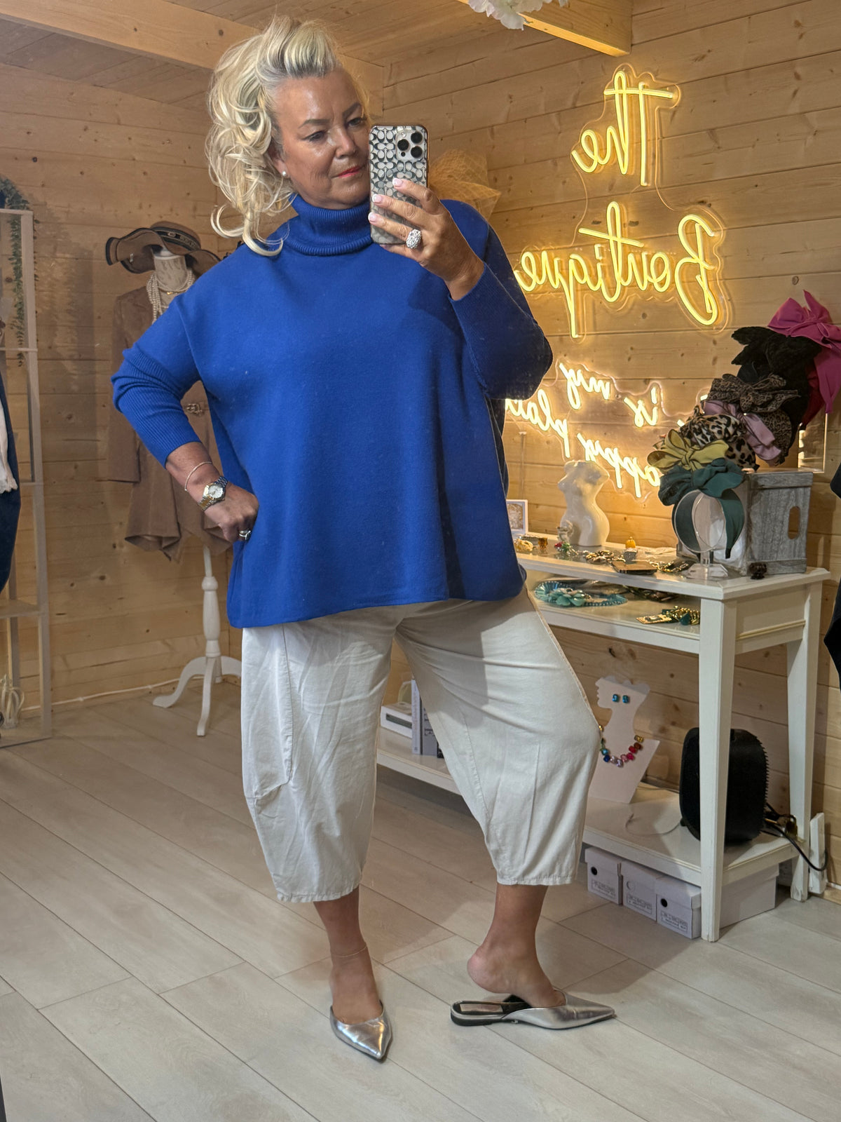 Pola cobalt blue jumper full length outfit with white slouch trousers and silver pointed mules