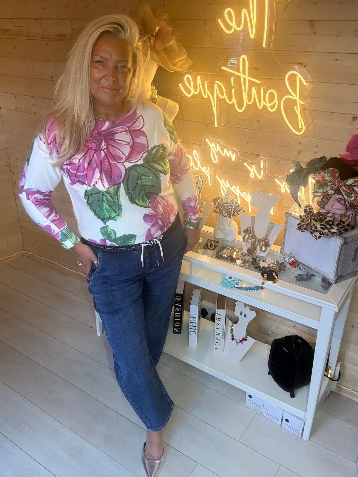 Rosa floral sequin jumper, front view styled with jeans
