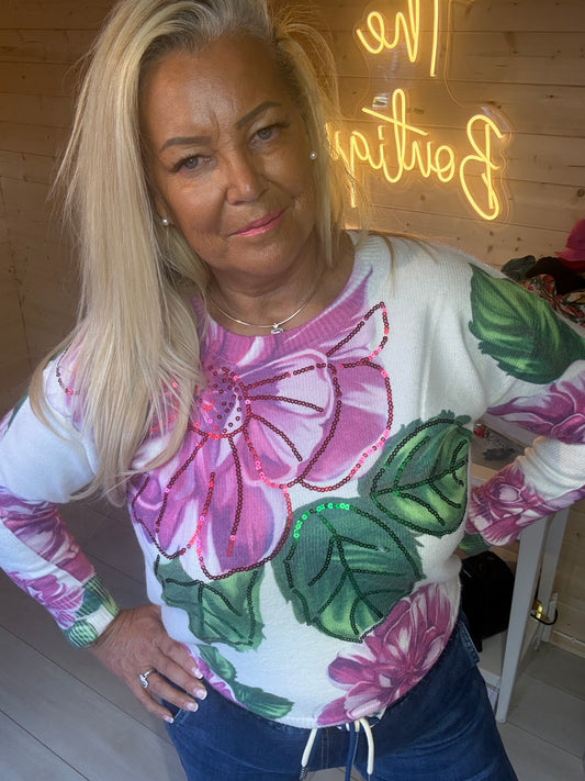 Rosa floral sequin jumper, full outfit view with jeans