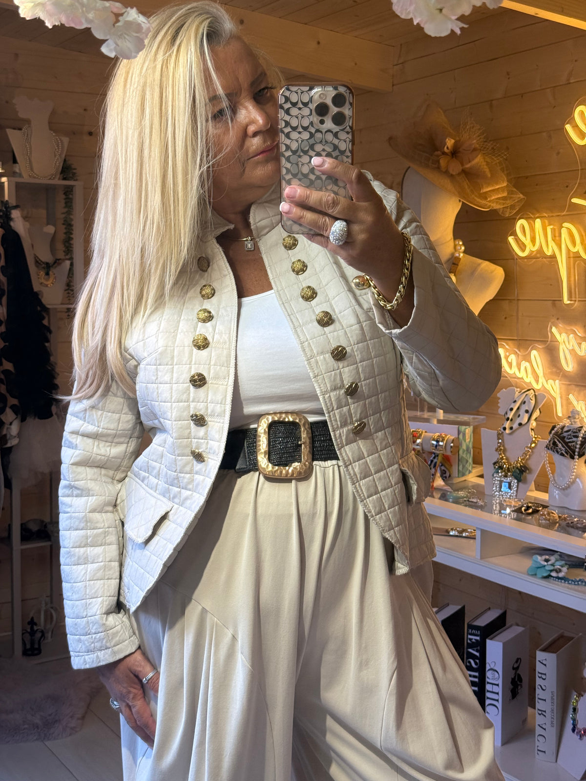 Vienna stone quilted military jacket styled with cream trousers and belt