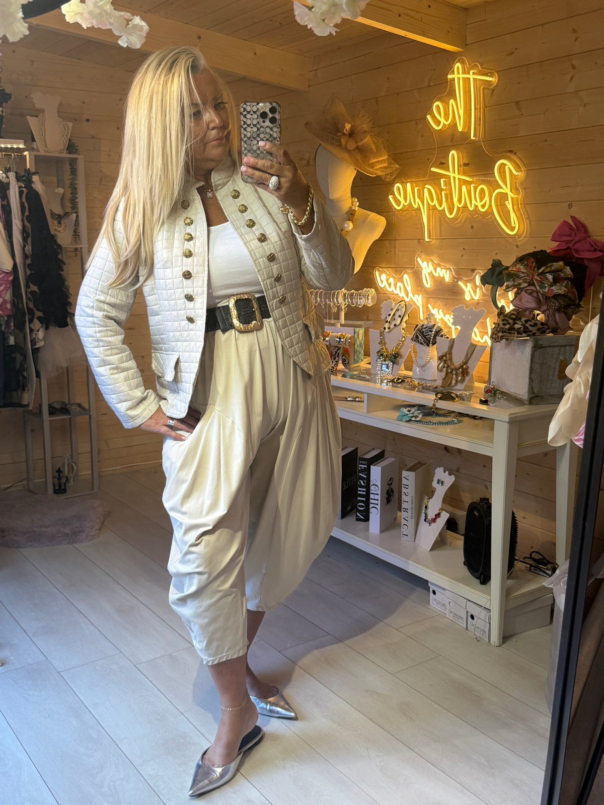 Vienna khaki quilted military jacket styled with cream trousers and belt
