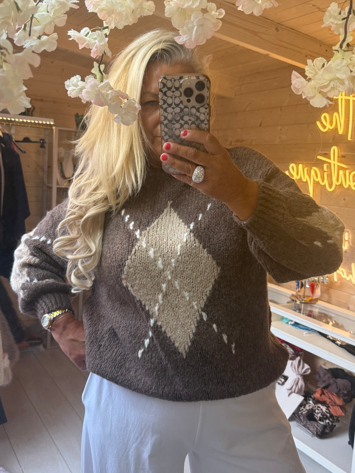 Close-up of Lucca Taupe jumper showing textured knit and ribbed hem