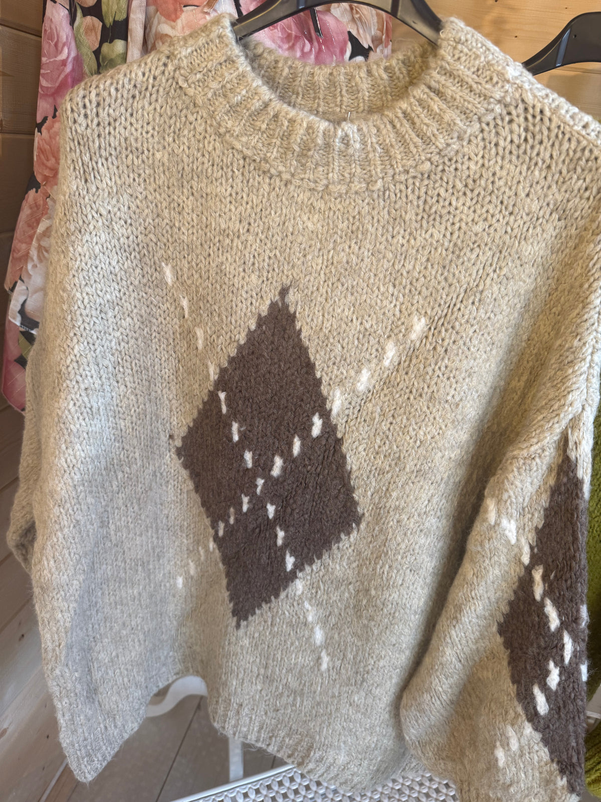Lucca Beige jumper showing round ribbed neckline and contrasting diamond pattern
