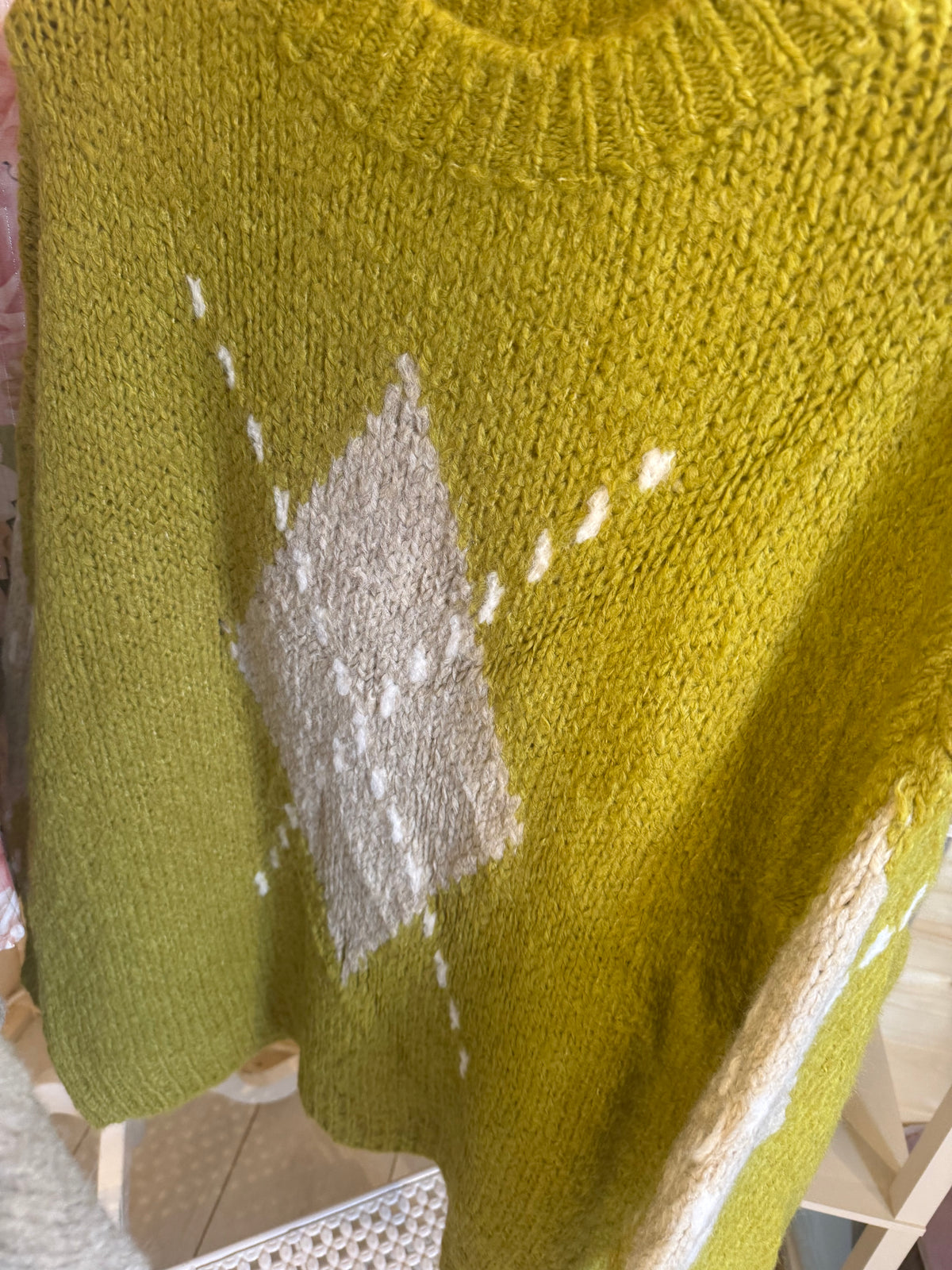 Lucca Apple Green jumper showing contrasting diamond design and knit texture