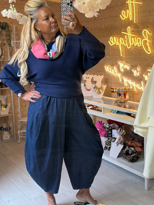 Asti Navy batwing jumper showing textured knit and defined hem, styled with a scarf sold separately