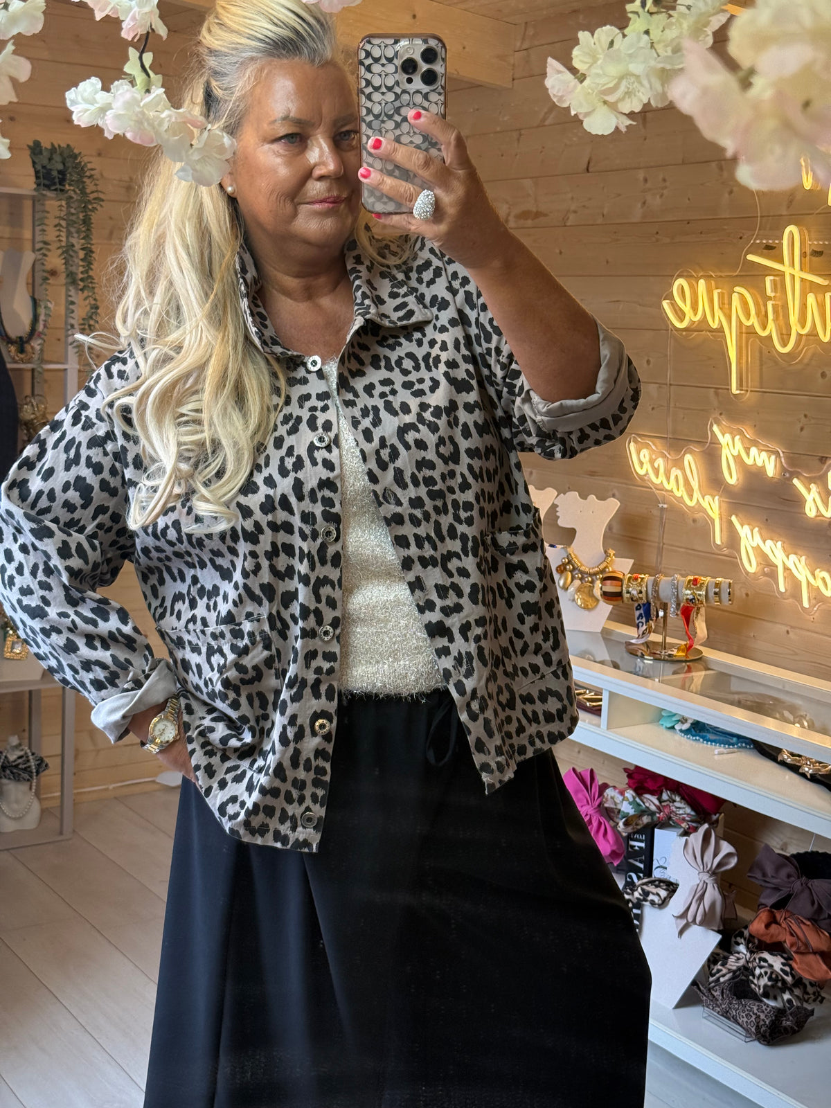 Prato leopard print jacket showing collar, button front and patch pockets, worn open