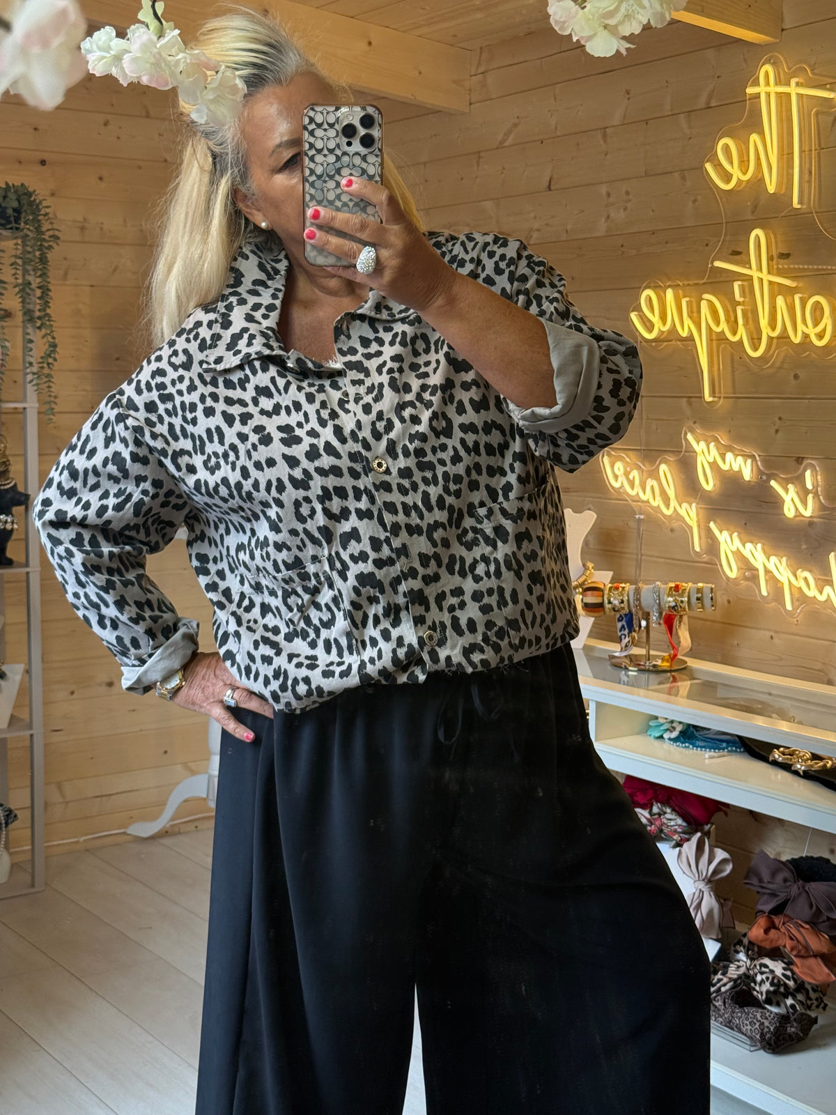 Prato leopard print jacket buttoned at the front, showing its relaxed shape and collar