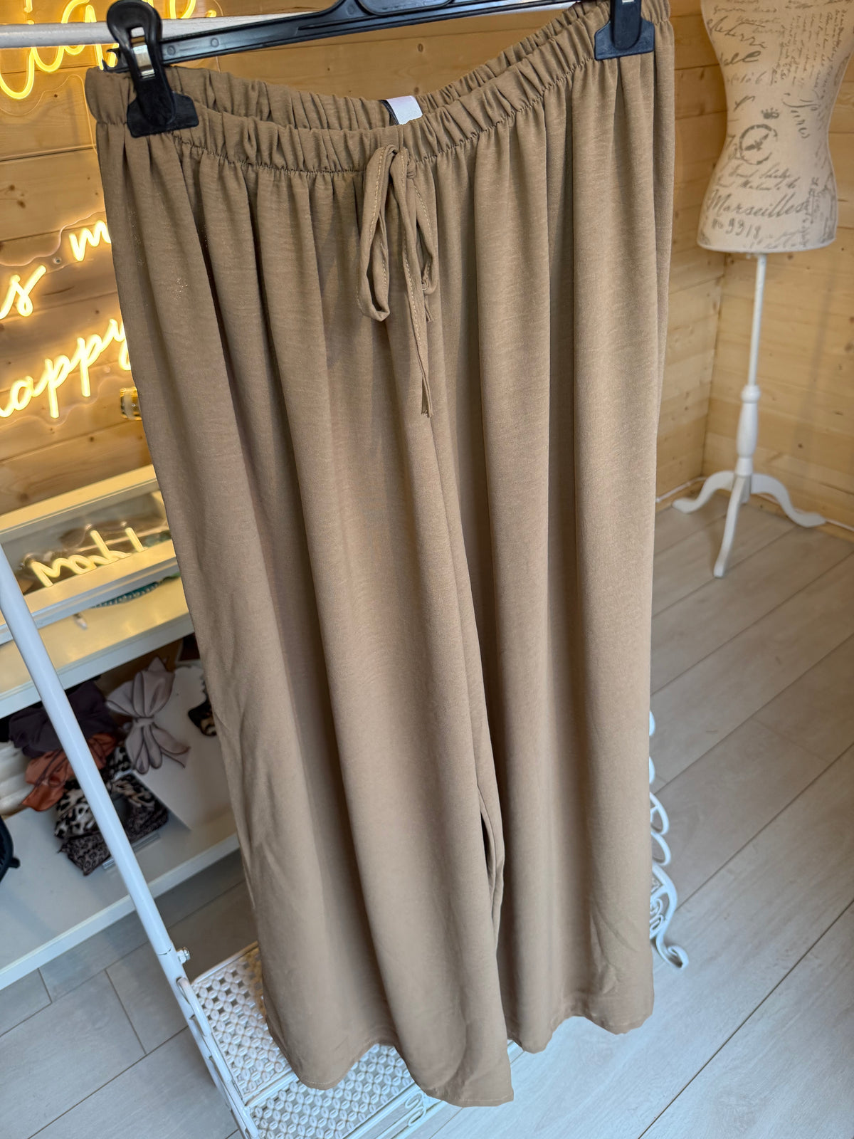 Noli Camel wide-leg trousers showing elasticated waist, front tie and plain legs