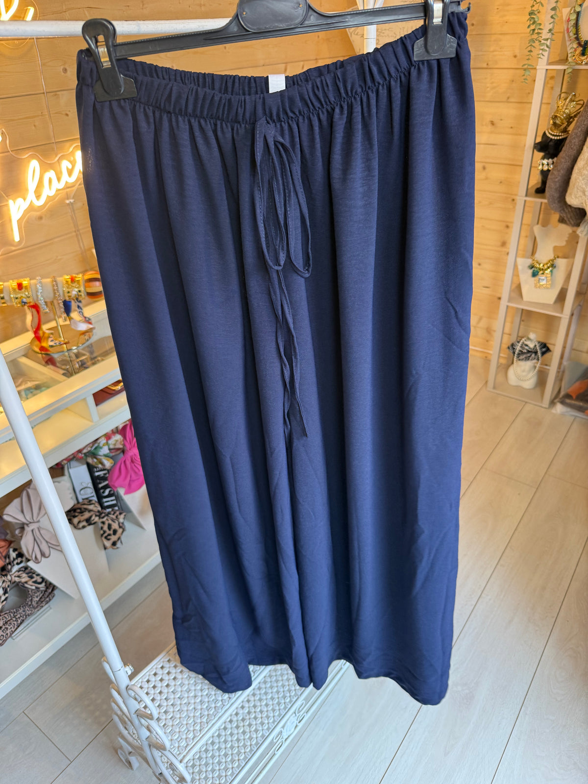 Noli Navy wide-leg trousers showing elasticated waistband and front tie detail