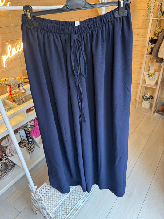 Noli Navy wide-leg trousers showing elasticated waistband and front tie detail