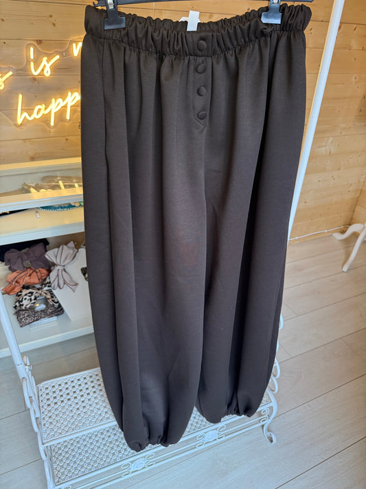 Lodi Brown balloon trousers showing elasticated waistband, matching front buttons and gathered hems