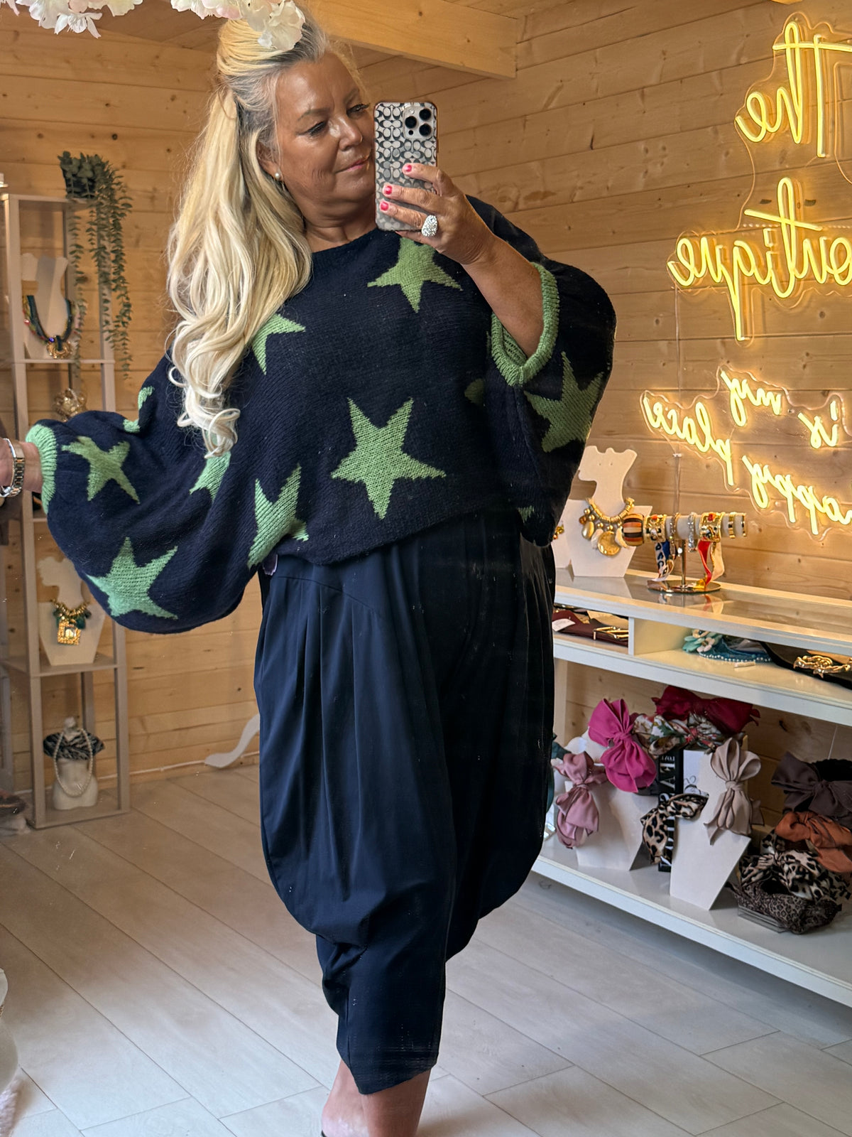 Vega navy and green star jumper showing its roomy sleeve shape