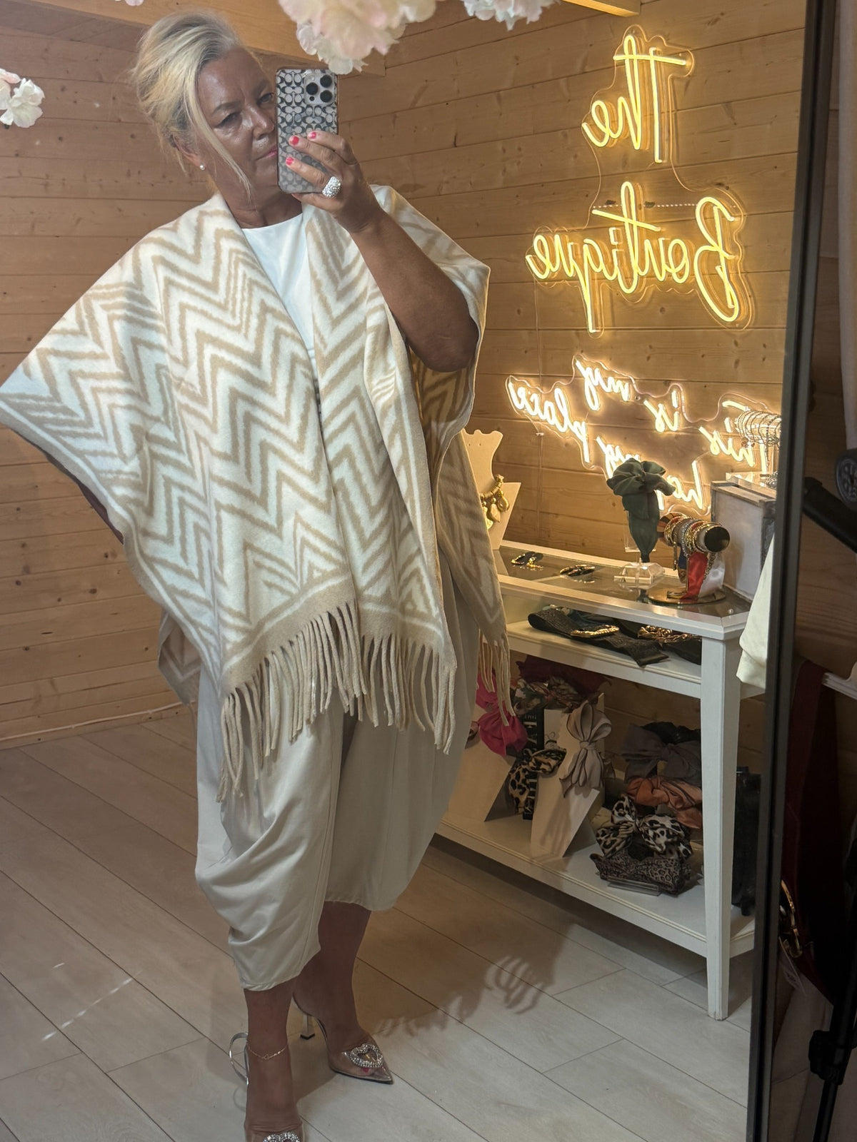 Alba cream and white chevron oversized cape shown open at the front with fringe detail