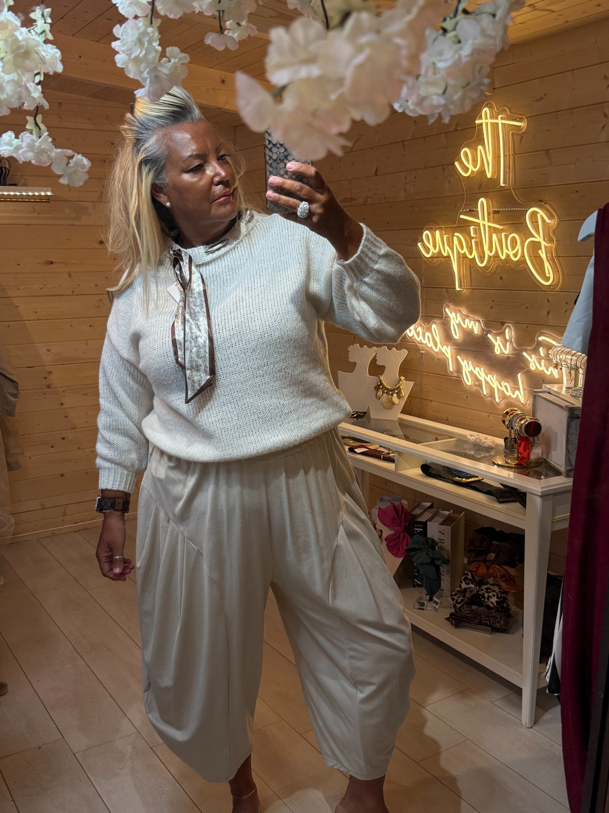 Arden cream knit jumper worn with cream slouch trousers