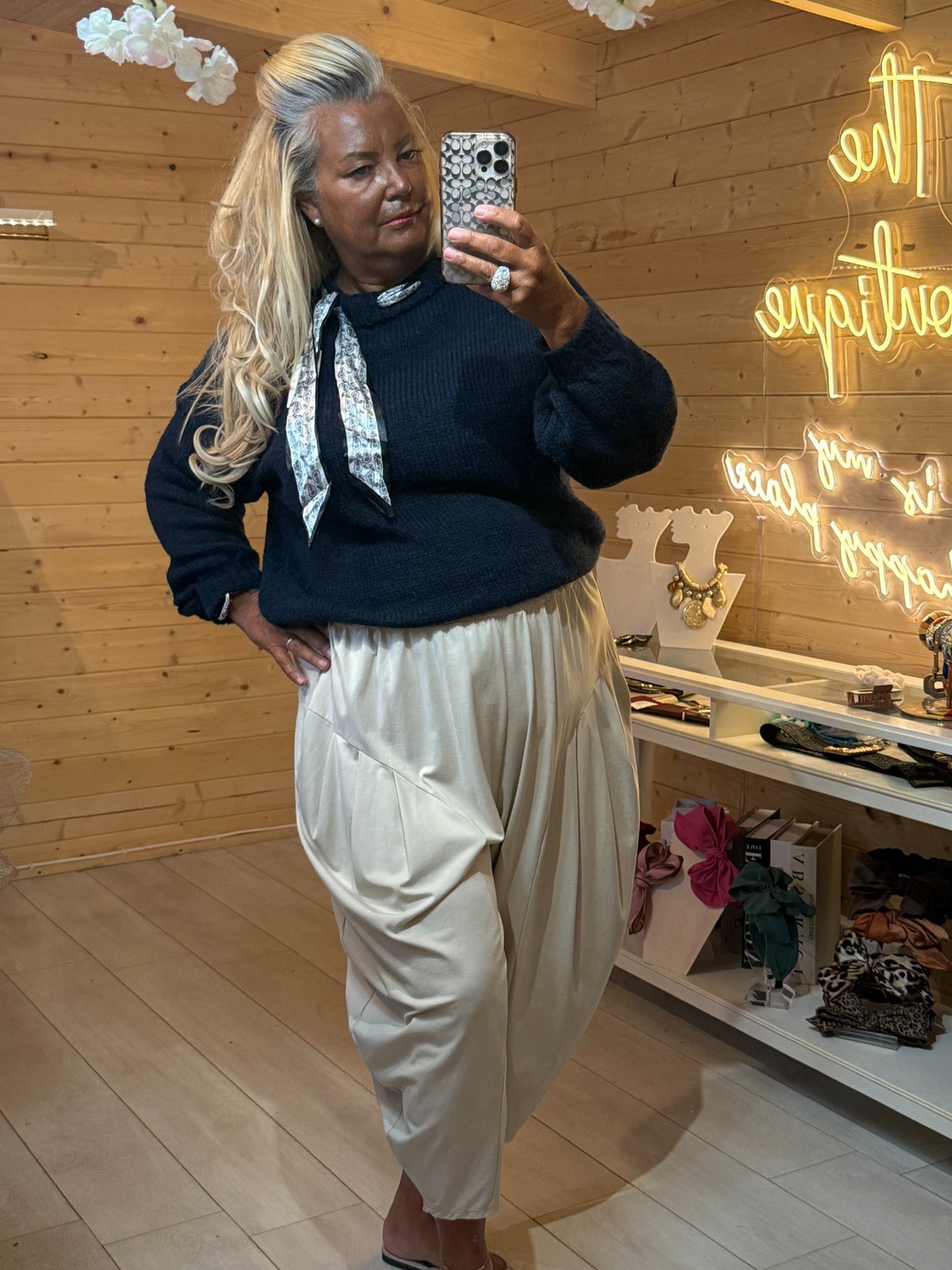 Navy Arden knitted jumper worn with cream slouch trousers