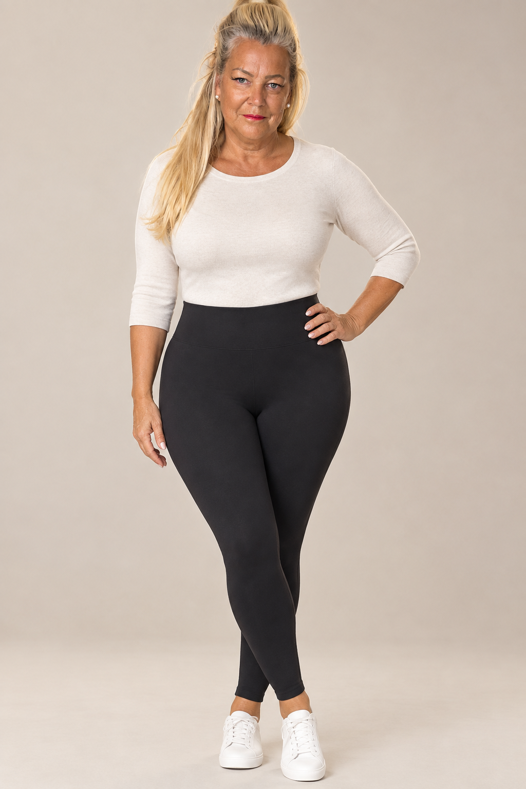 Model wearing black high-waisted seamless thermal leggings with a light neutral top