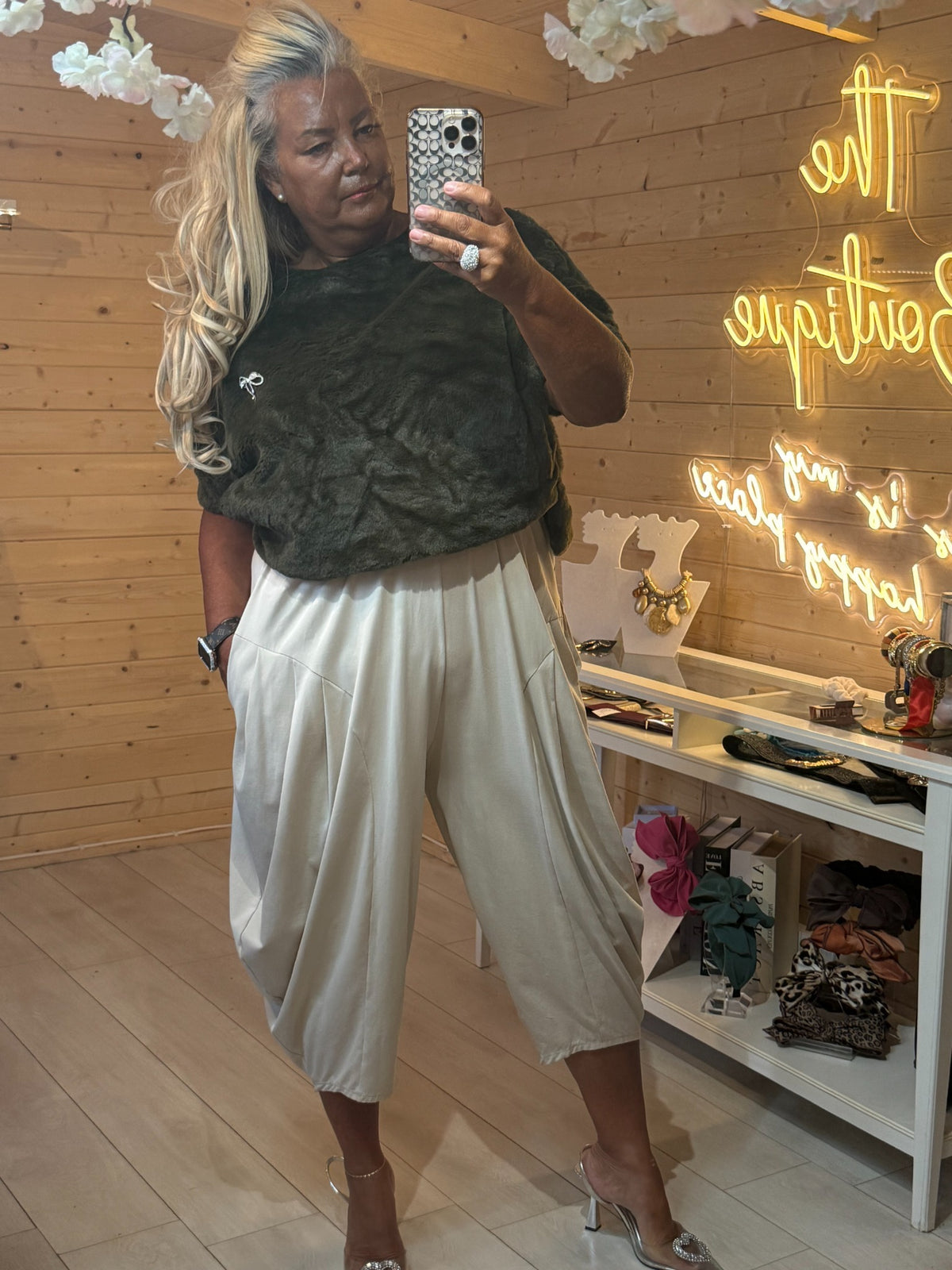 Orla khaki green faux fur top styled with cream slouch trousers