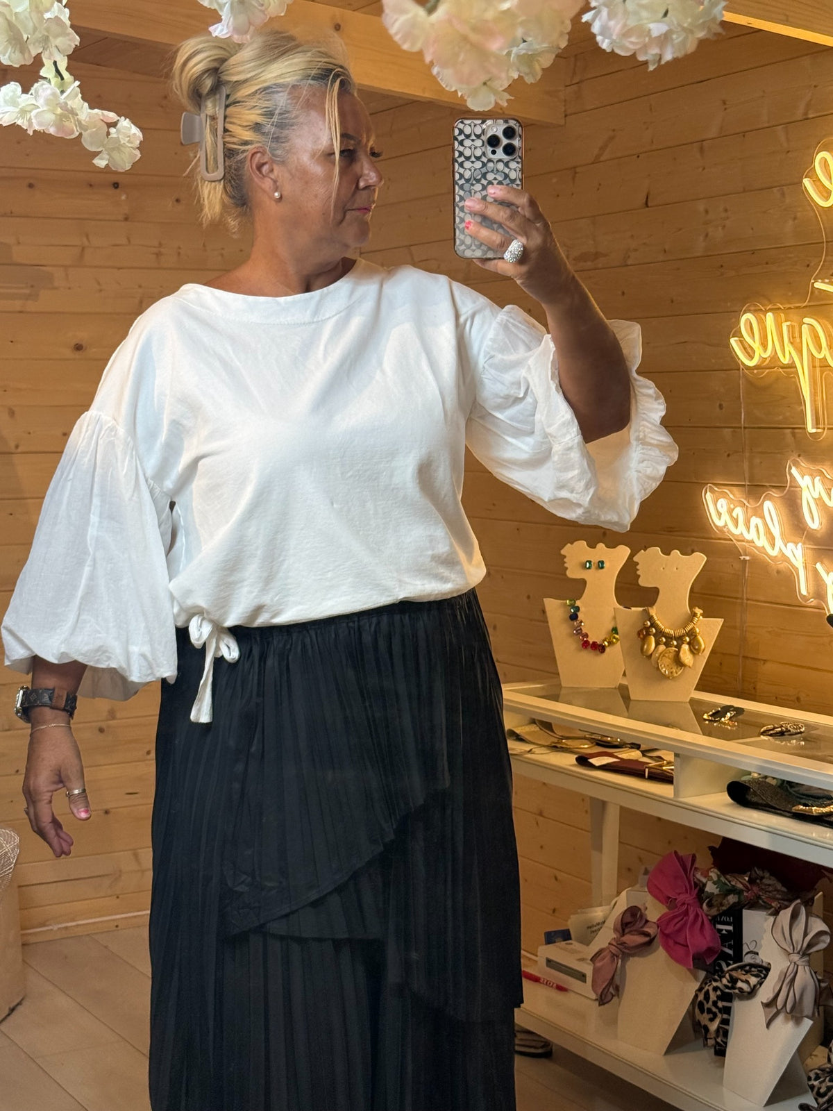Close view of white Orla statement puff sleeve top with gathered cuff detailing