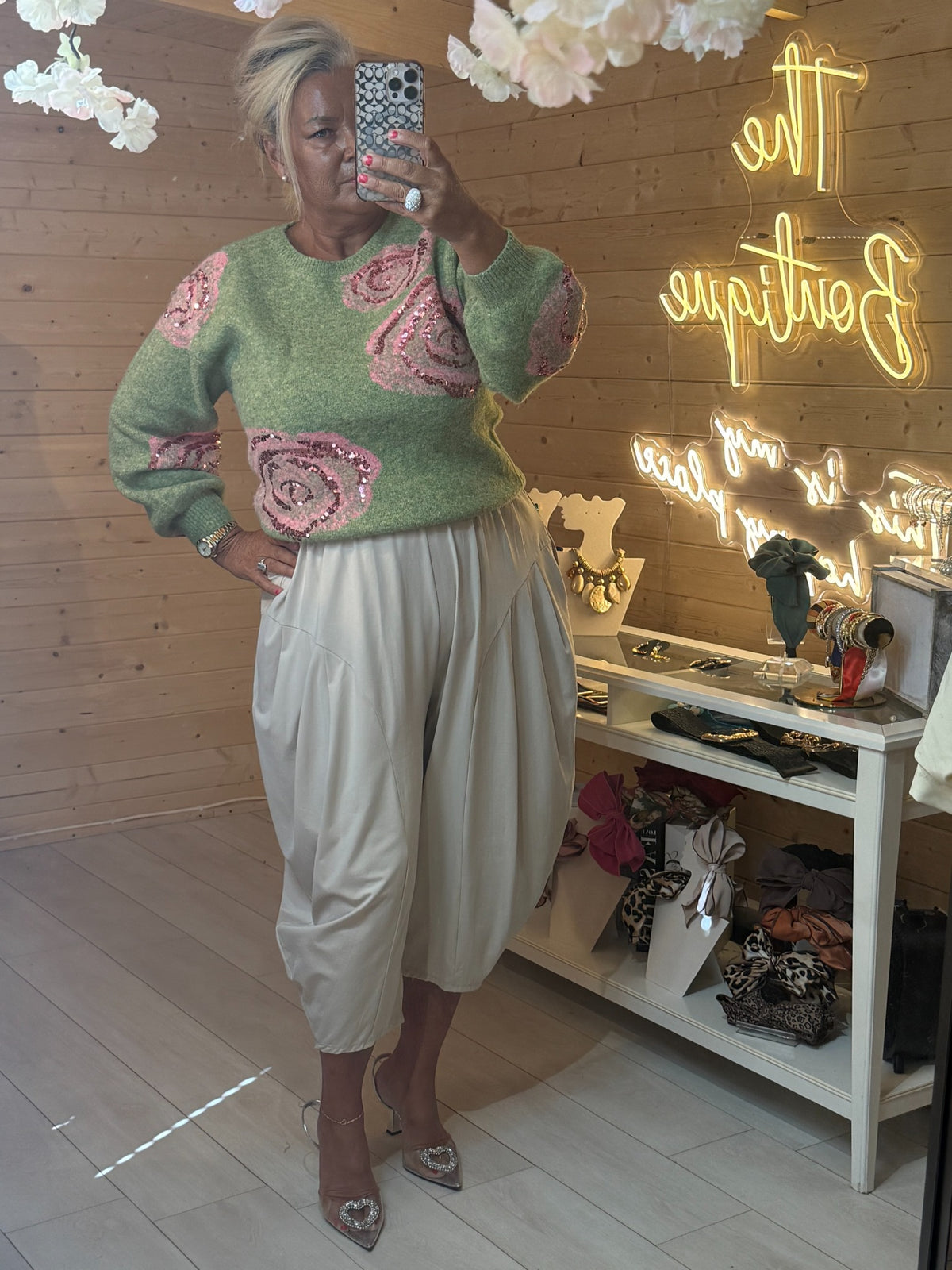 Rosella sage green sequin rose jumper with cream trousers and heels