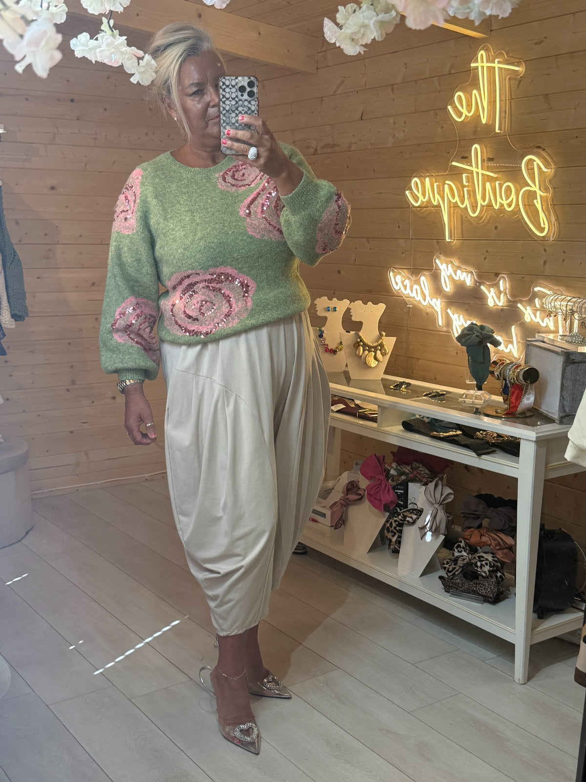 Rosella soft sage green knitted jumper with pink sequinned roses and ribbed cuffs