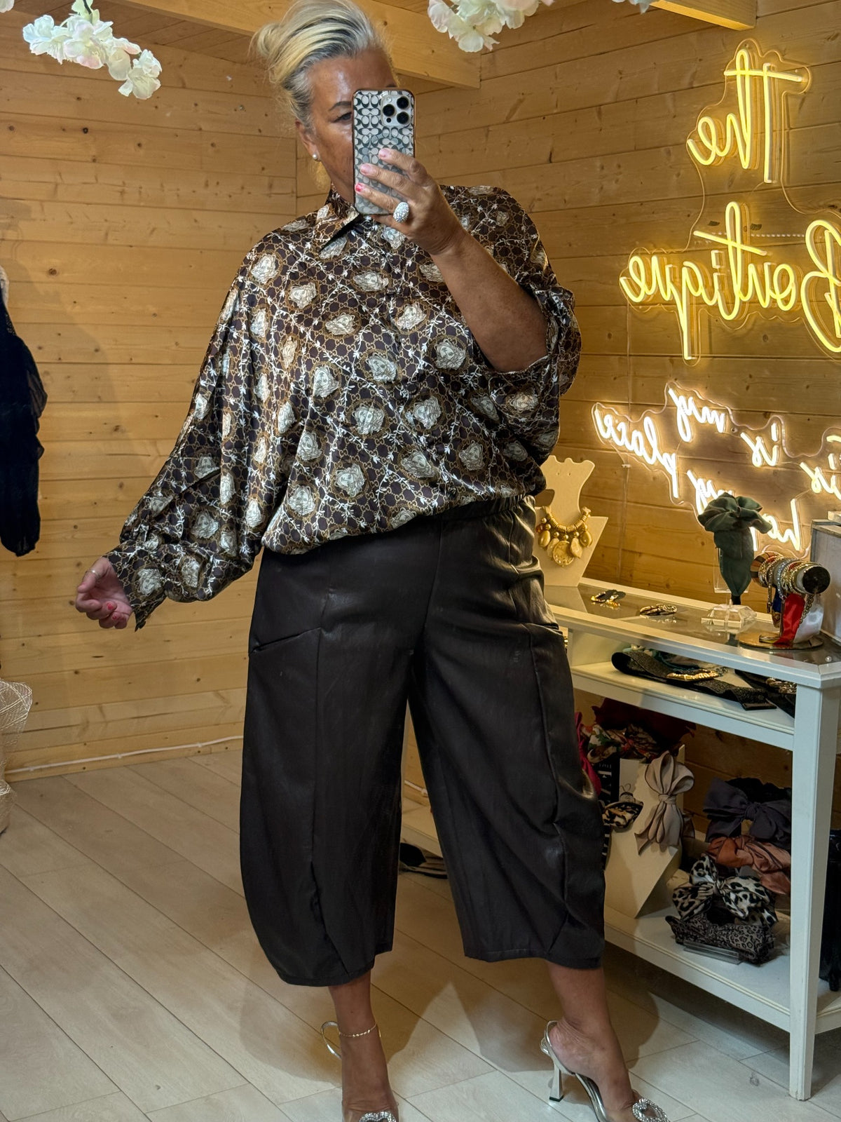 Sorella brown satin-feel blouse with cream and gold chain medallion print styled with black trousers