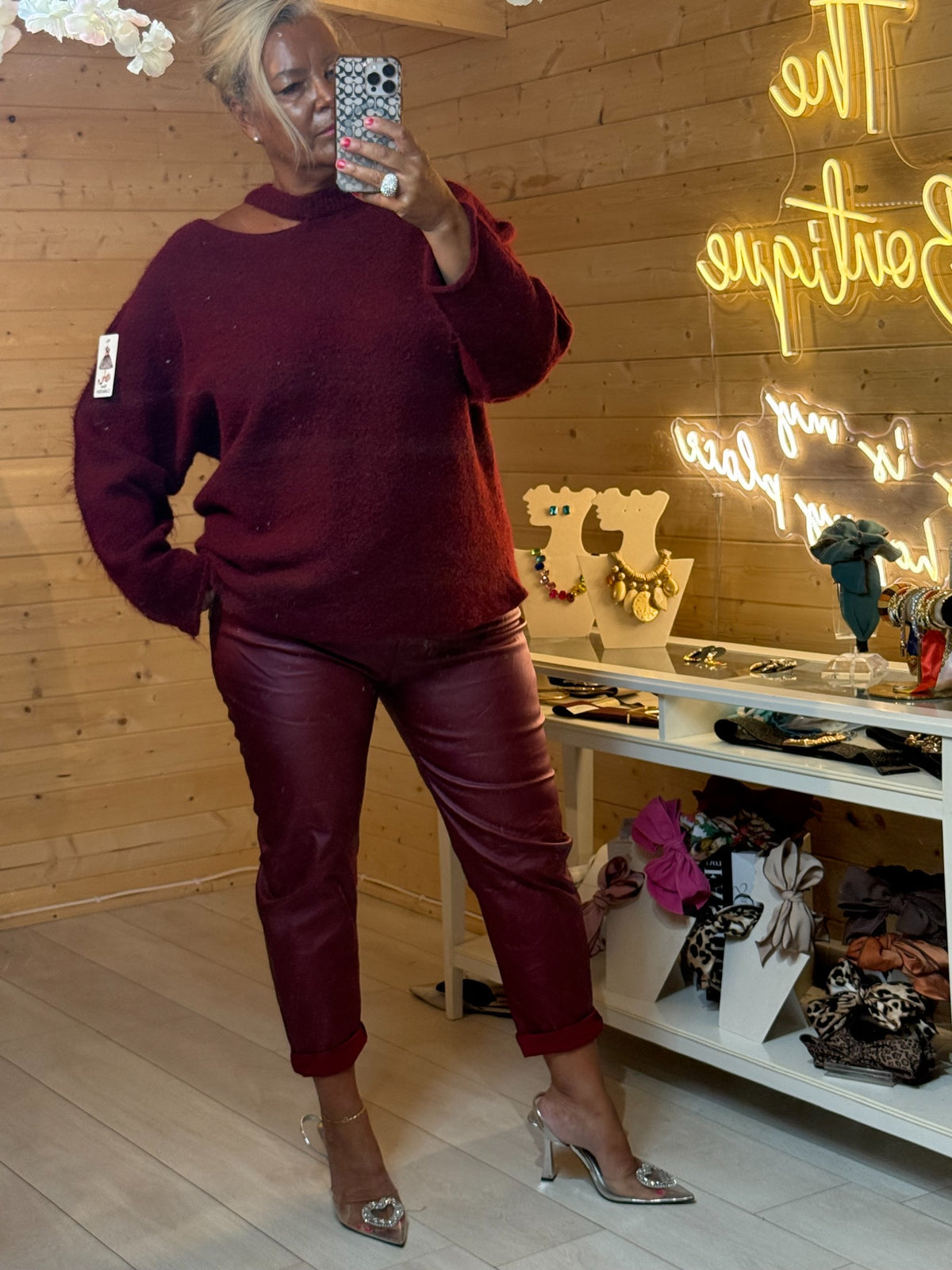 Burgundy PU coated magic trousers styled with burgundy jumper and silver heels